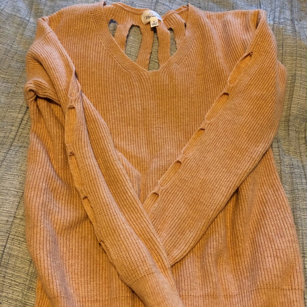 Peach sweater with cut outs